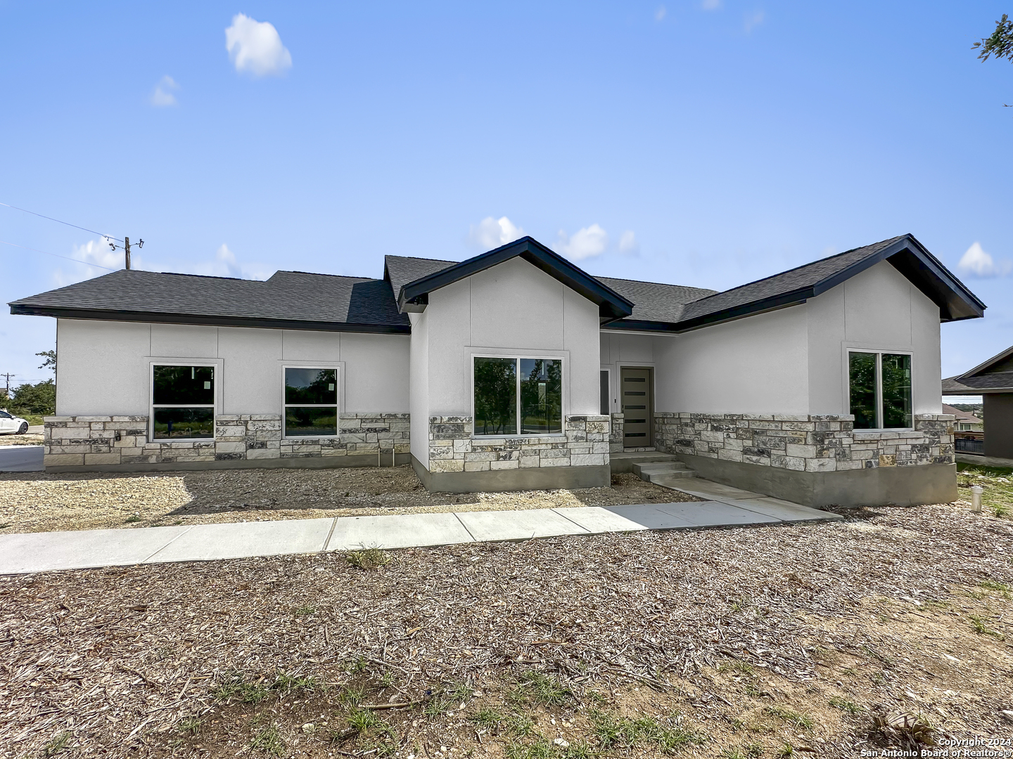 301 Hiram Cook Blanco, TX 78606 - Photo 1 of 16 a view of a house with a yard and sitting area