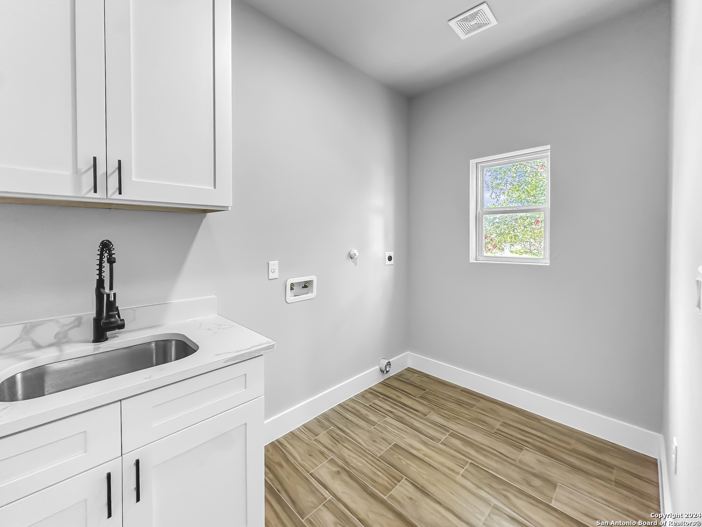 301 Hiram Cook Blanco, TX 78606 - Photo 15 of 16 a kitchen with cabinets appliances and a sink