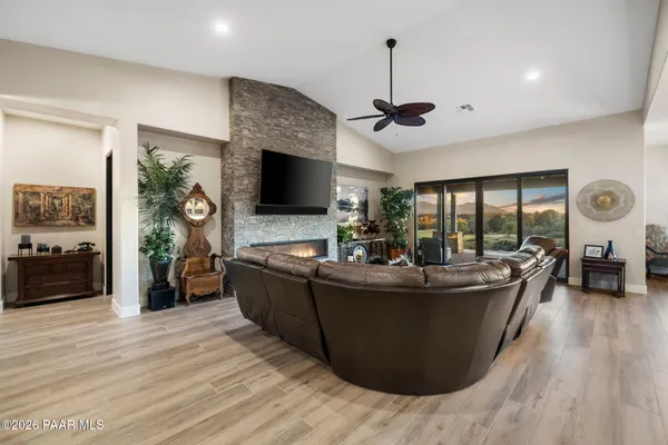 a kitchen with a stove center island and couches