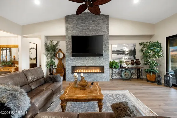 a kitchen with stainless steel appliances granite countertop a sink a stove and a refrigerator