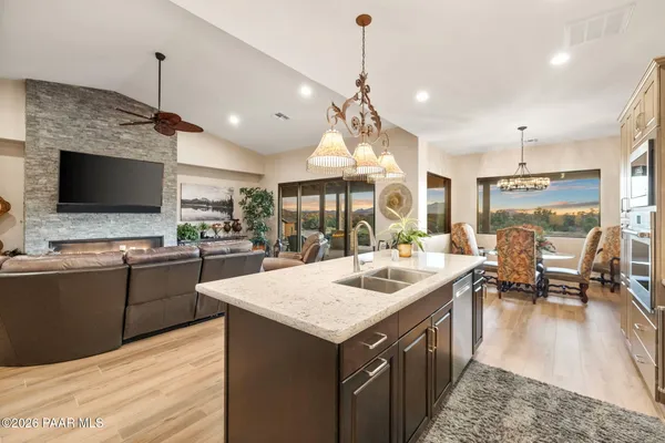 a bathroom with double vanity sinks and a large mirror