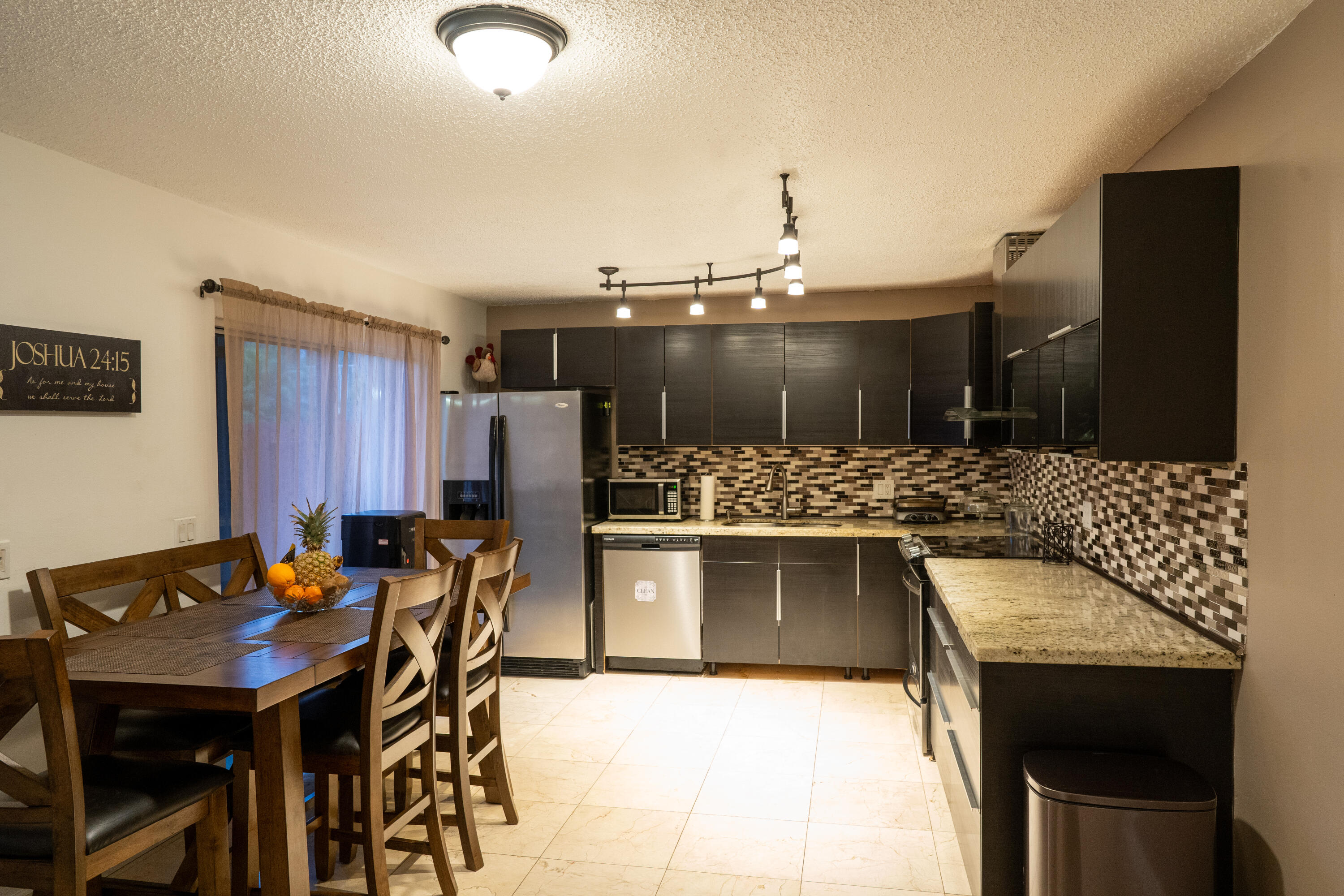 22164 Boca Rancho Drive, Unit C Boca Raton, FL 33428 - Photo 14 of 29 a kitchen with a table and chairs
