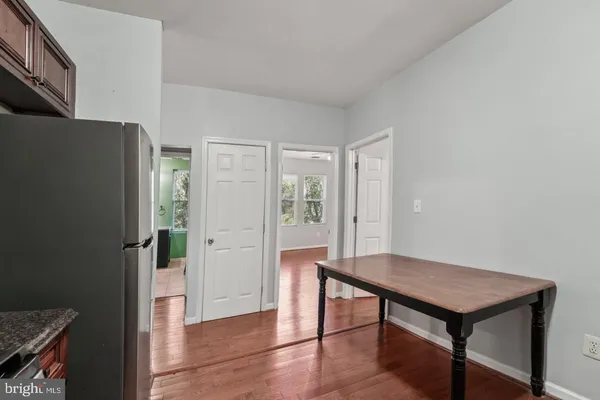 a view of a livingroom with furniture and wooden floor