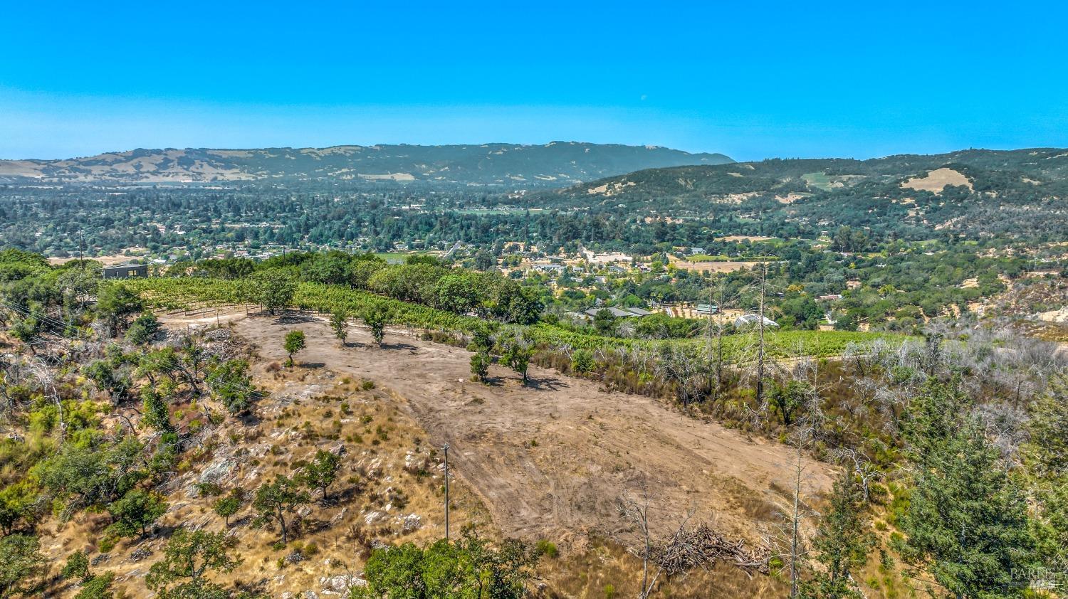 Gorgeous views from gated and fence 5.25+- acre parcel with cleared building site, almost 360' view. New well, 3-bedroom vested Adobe Associates septic system design, electricity. Bonus: Newer barn with corrals and an arena. East side Sonoma minutes to town.
