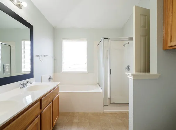 a bathroom with a bathtub and a sink