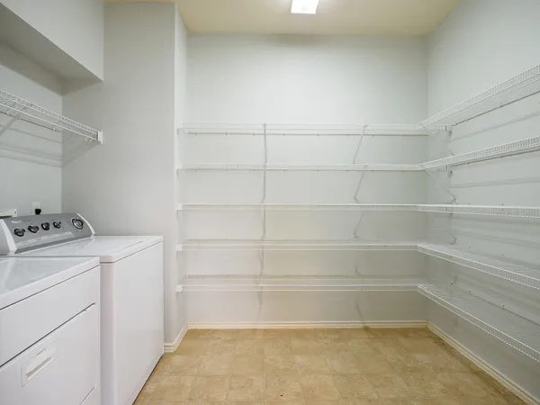 a view of storage and utility room with washer and dryer