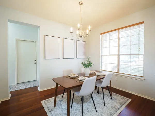 a view of a dining room with furniture window and wooden floor