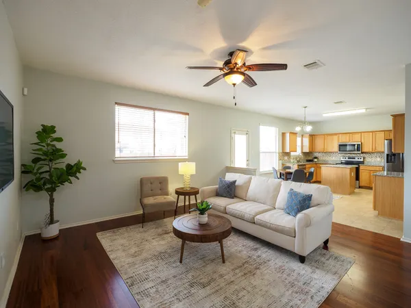 a living room with furniture or couch and a potted plant