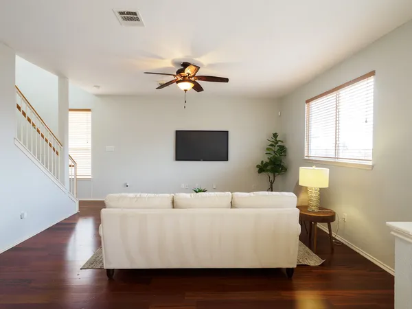 a living room with a bed furniture and a window