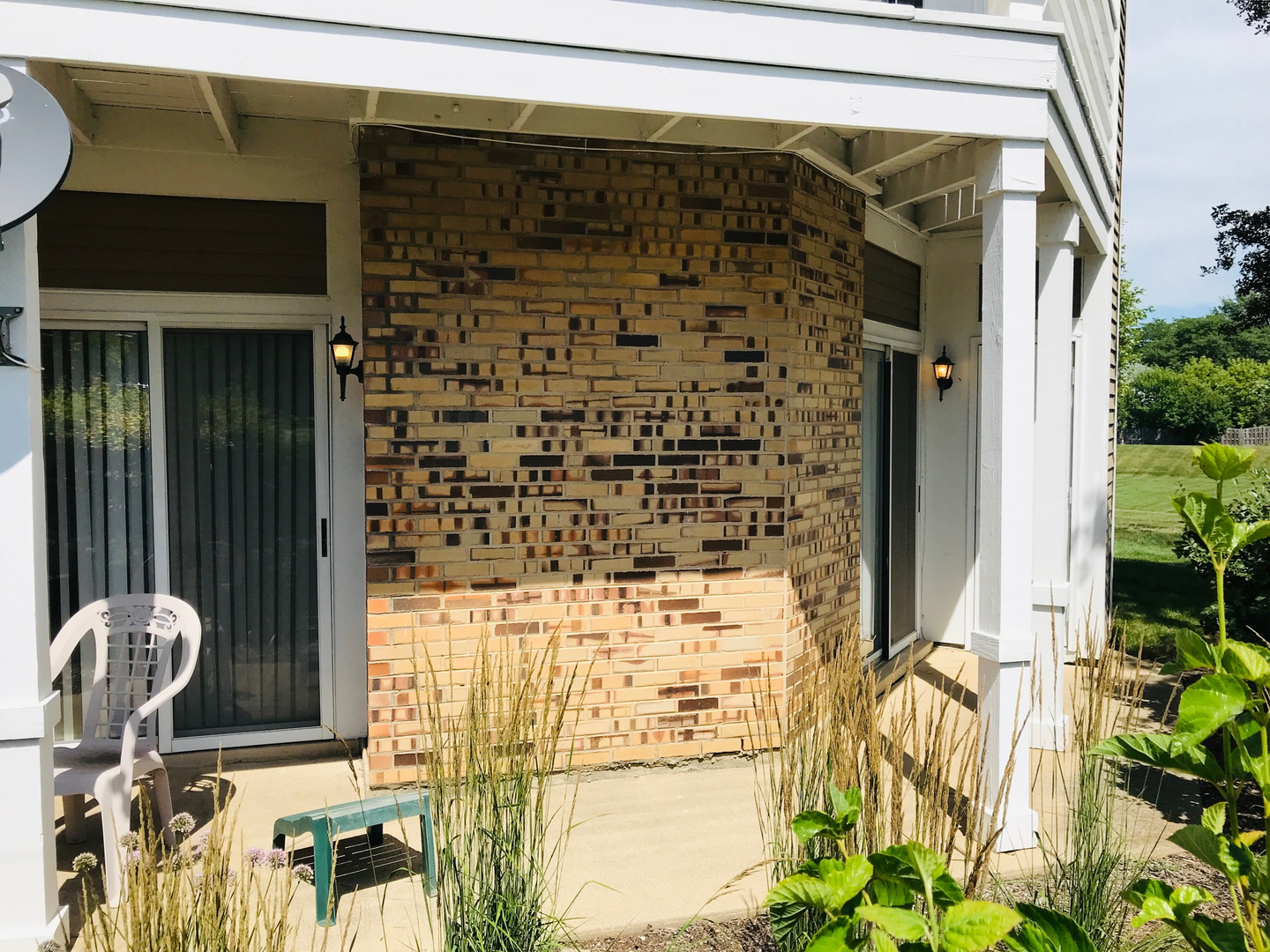 1191 Ranchview Court Buffalo Grove, IL 60089 - Photo 17 of 20 a front view of a house with outdoor seating