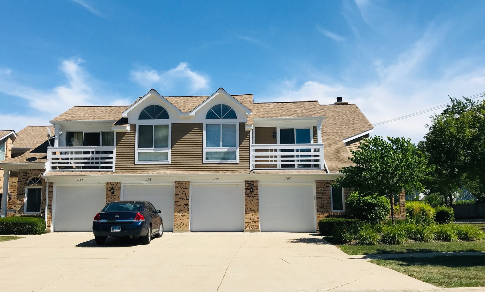 1191 Ranchview Court Buffalo Grove, IL 60089 - Photo 20 of 20 a front view of a house with a garden