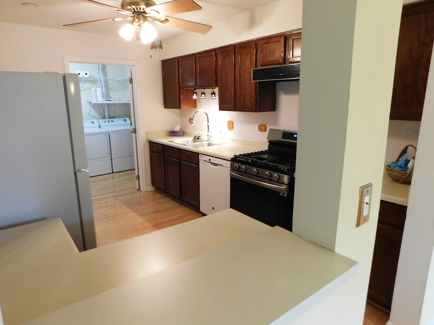 1191 Ranchview Court Buffalo Grove, IL 60089 - Photo 7 of 20 a kitchen with kitchen island a sink appliances and cabinets