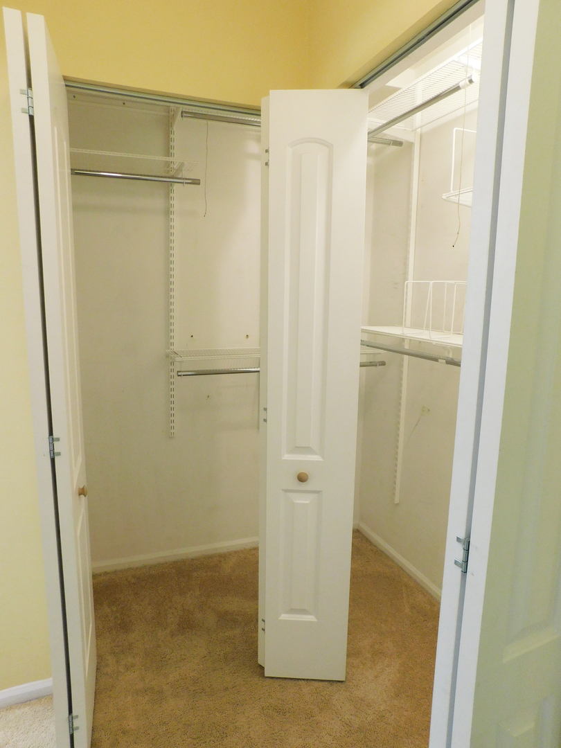 1191 Ranchview Court Buffalo Grove, IL 60089 - Photo 10 of 20 a bathroom with a glass door shower