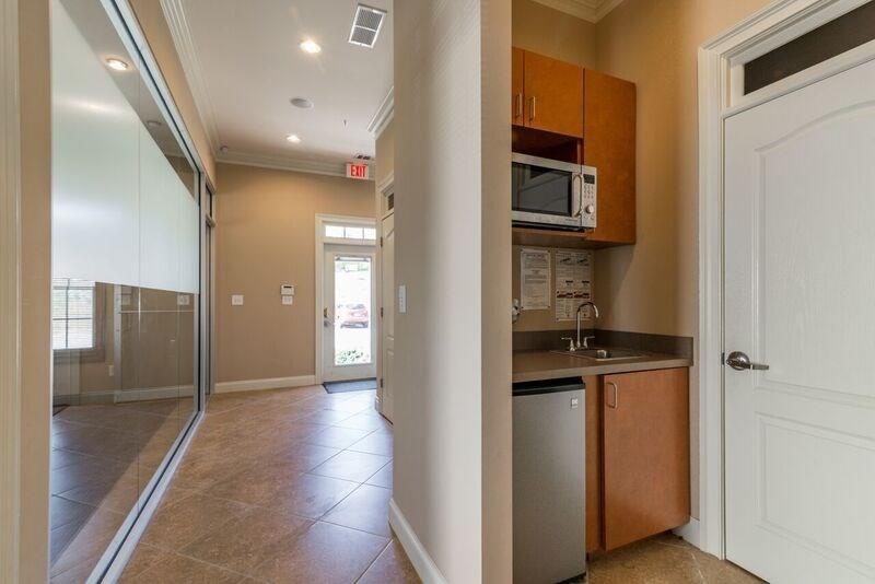 4485 Tench Road, Unit UN1410 Suwanee, GA 30024 - Photo 2 of 6 a view of a hallway with wooden shelves