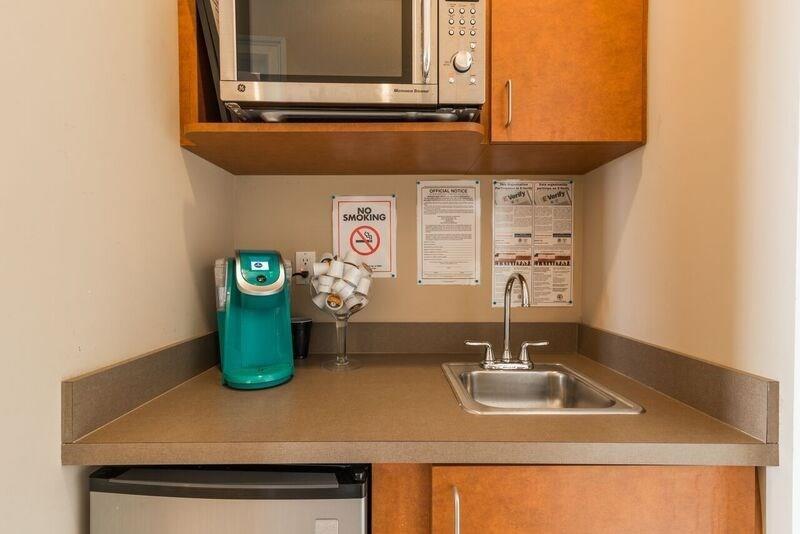 4485 Tench Road, Unit UN1410 Suwanee, GA 30024 - Photo 3 of 6 a bathroom with a sink and a mirror