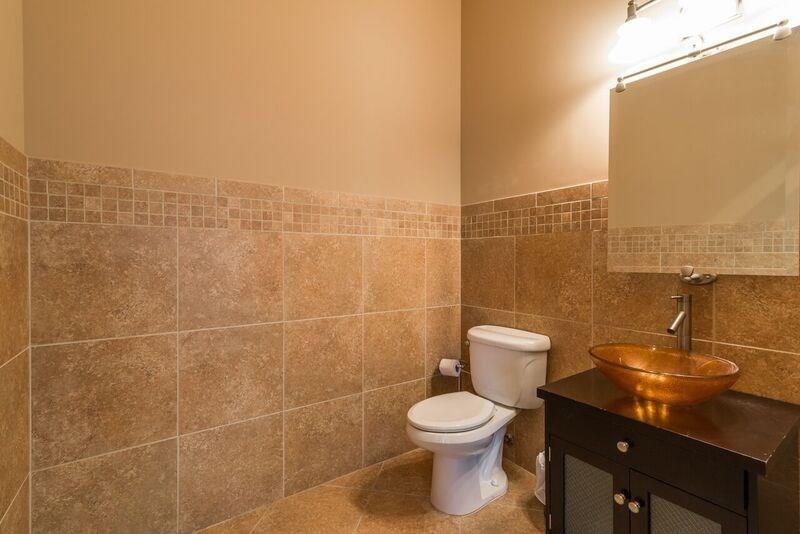 4485 Tench Road, Unit UN1410 Suwanee, GA 30024 - Photo 4 of 6 a bathroom with a toilet and a sink