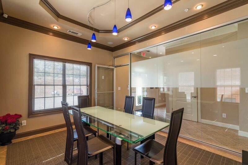 4485 Tench Road, Unit UN1410 Suwanee, GA 30024 - Photo 5 of 6 a view of a dining room with furniture window and wooden floor