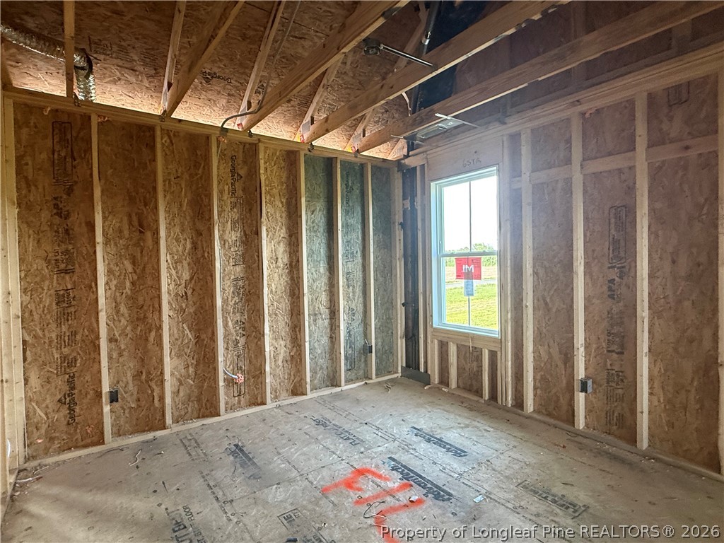 5090 Ross West Road Dunn, NC 28334 - Photo 10 of 15 a view of a bathroom with wooden floor and windows