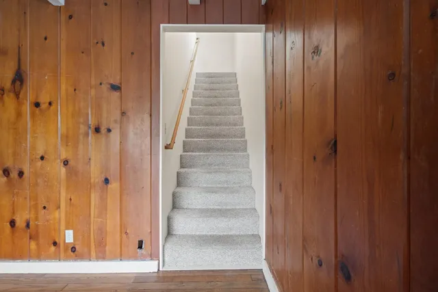 a view of a elevator with wooden floor
