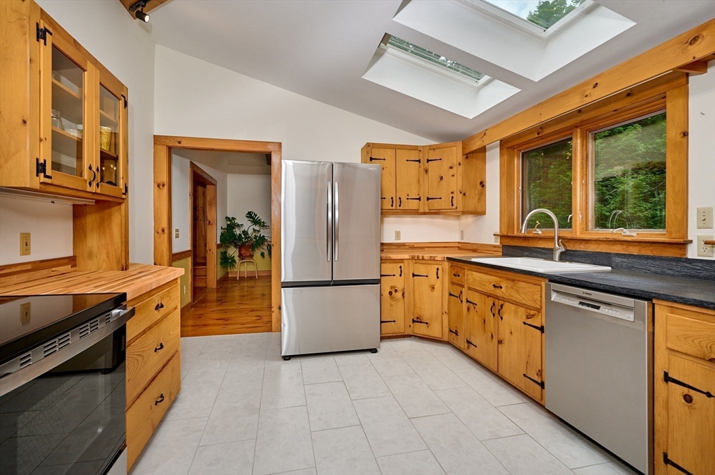 10 Fox Road Buckland, MA 01370 - Photo 11 of 42 a kitchen with granite countertop a refrigerator and a sink