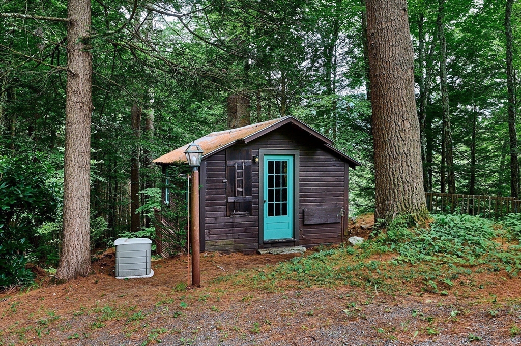 10 Fox Road Buckland, MA 01370 - Photo 35 of 42 a view of a wooden house with a yard and plants