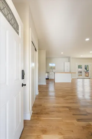 a view of a living room with hardwood floor