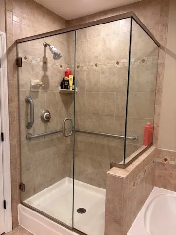 a bathroom with a shower and a shower head