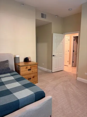 a bedroom with a bed and cabinets