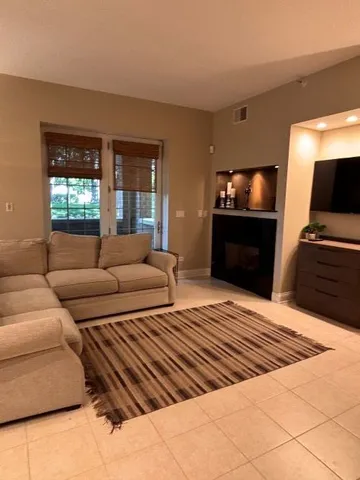 a bedroom with furniture and a flat screen tv