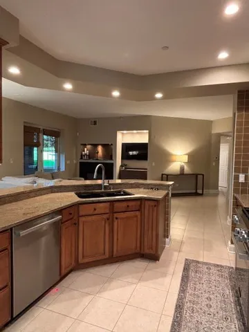 a large kitchen with lots of counter space and a sink