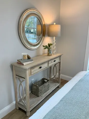 a room with a mirror and a table