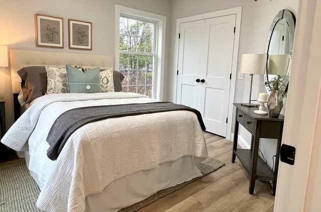 a bedroom with a bed and a window