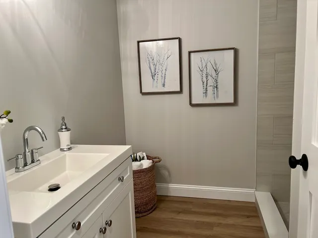 a bathroom with a sink and mirror