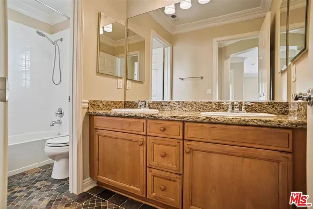 a view of a balcony with wooden floor and fence