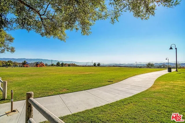 a view of a yard with a swimming pool