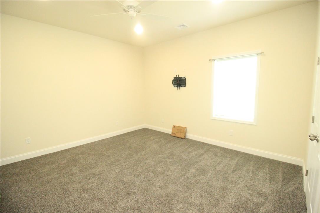 3083 Penn Allen Road, Unit B Nazareth, PA 18064 - Photo 6 of 21 A well-lit bedroom features plush gray carpeting, a bright window, and a ceiling fan for comfort.