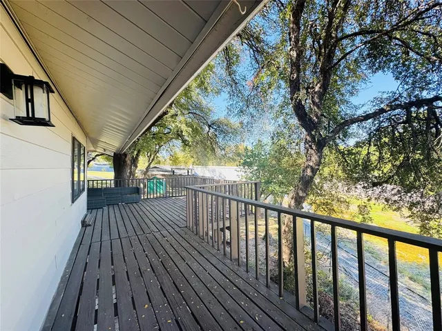 a view of deck with wooden floor and fence