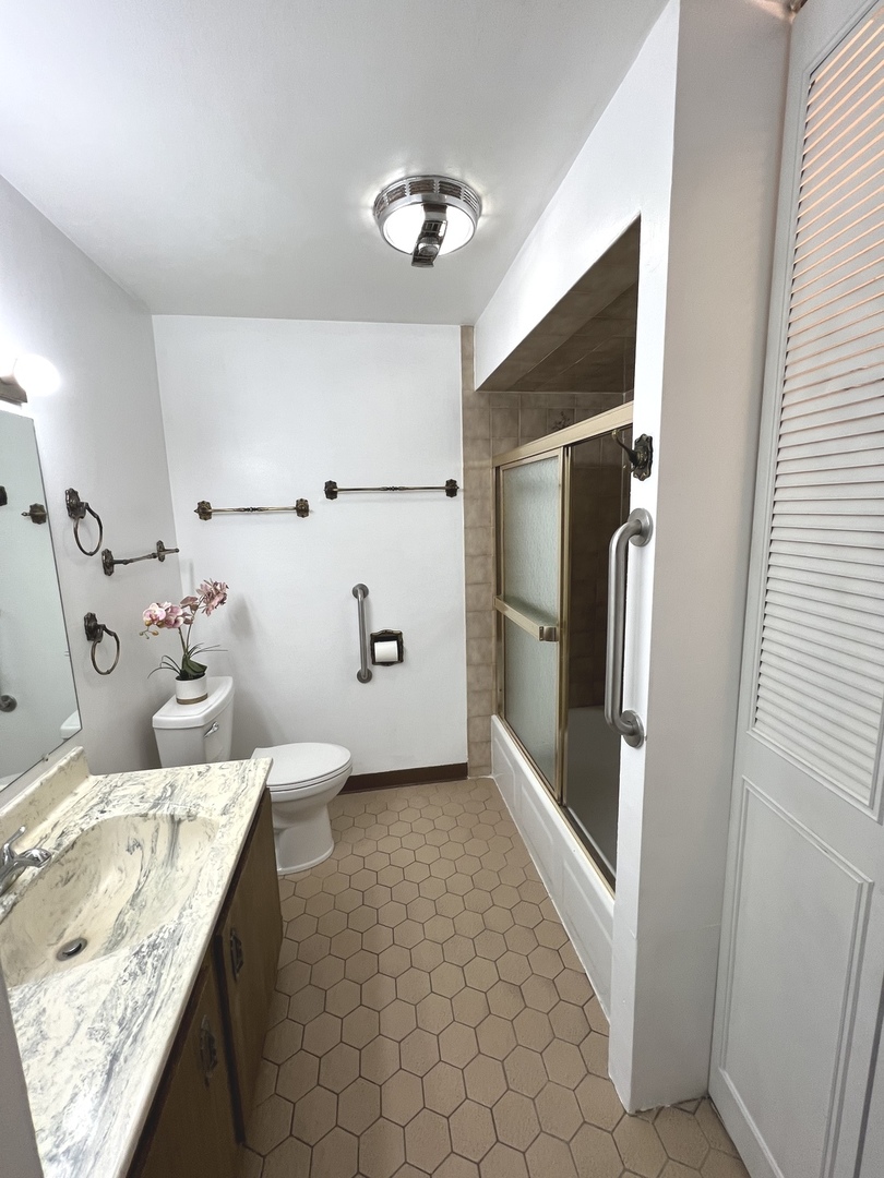 1706 Lakeview Drive Wheeling, IL 60090 - Photo 12 of 14 a bathroom with a double vanity sink mirror and shower