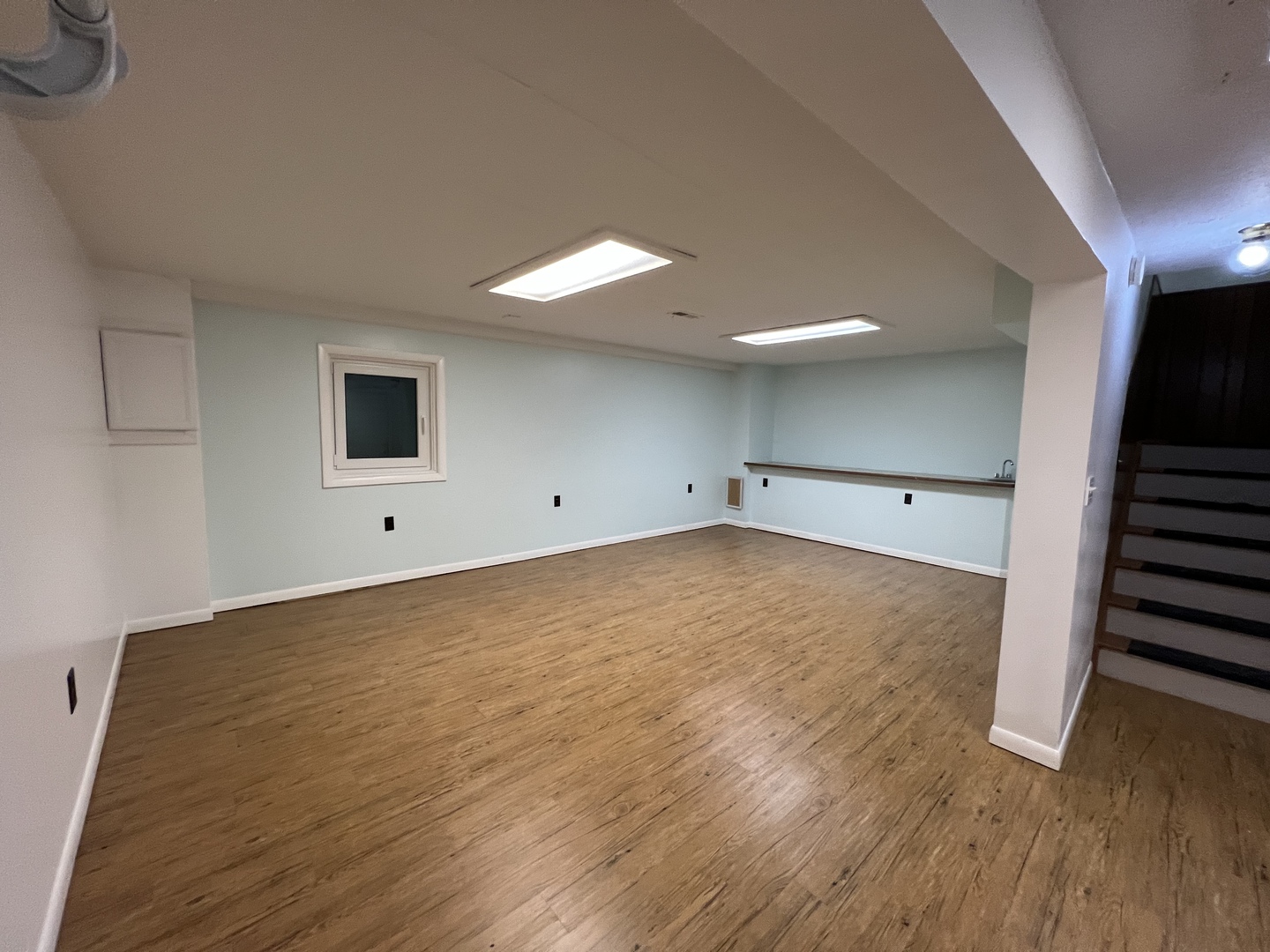 1706 Lakeview Drive Wheeling, IL 60090 - Photo 13 of 14 a view of a livingroom with wooden floor and stairs