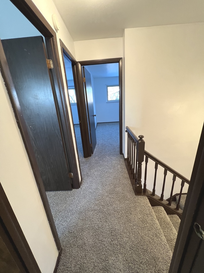 1706 Lakeview Drive Wheeling, IL 60090 - Photo 9 of 14 a view of a hallway with windows