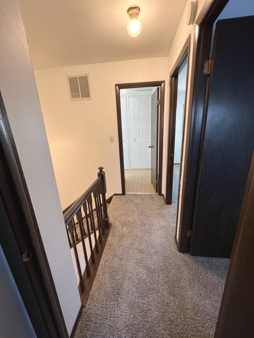 1706 Lakeview Drive Wheeling, IL 60090 - Photo 10 of 14 a view of a hallway with staircase