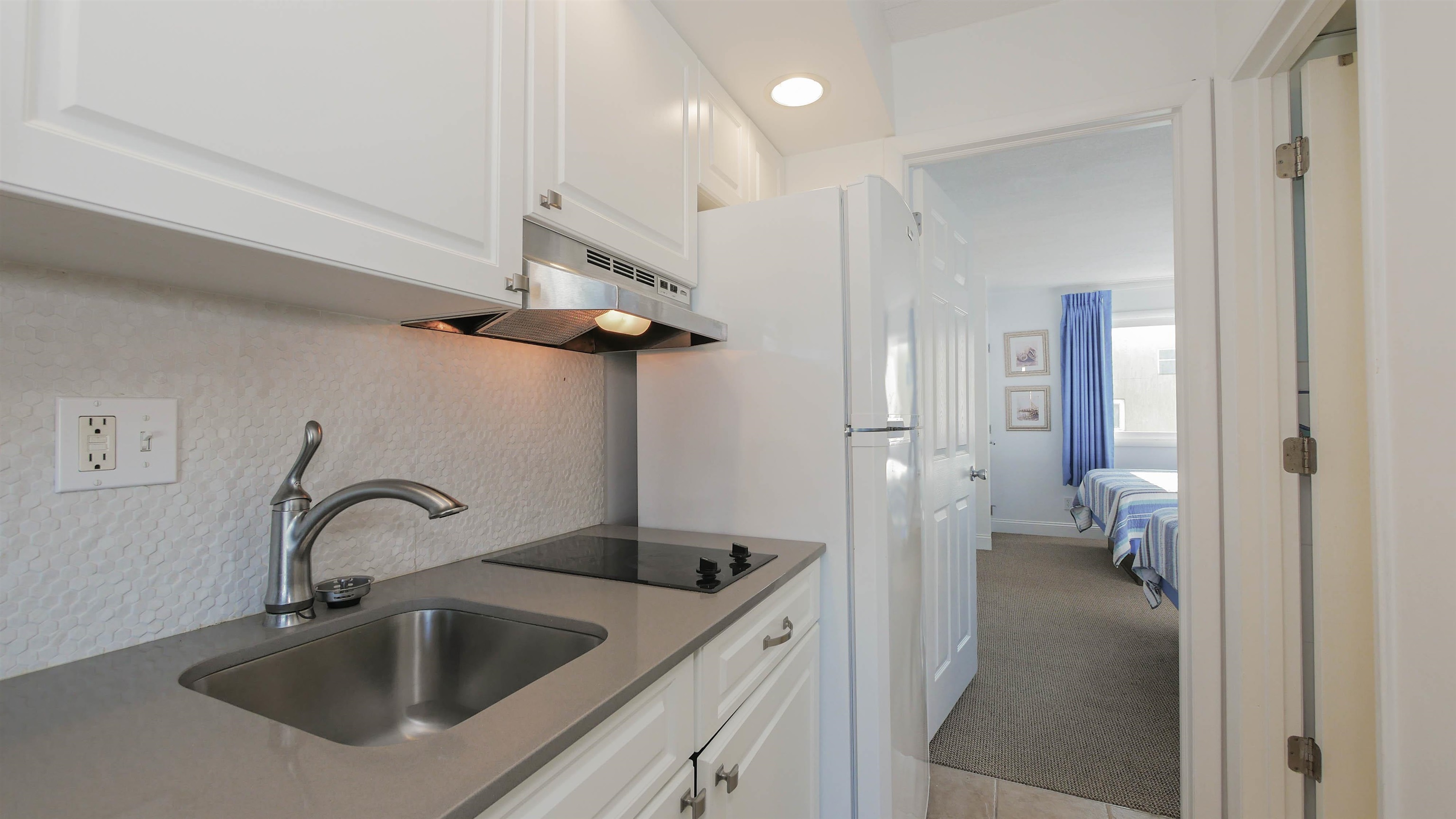 7800 Dune Drive, Unit 209 Avalon, NJ 08202 - Photo 12 of 21 a view of a bathroom sink and a bathroom