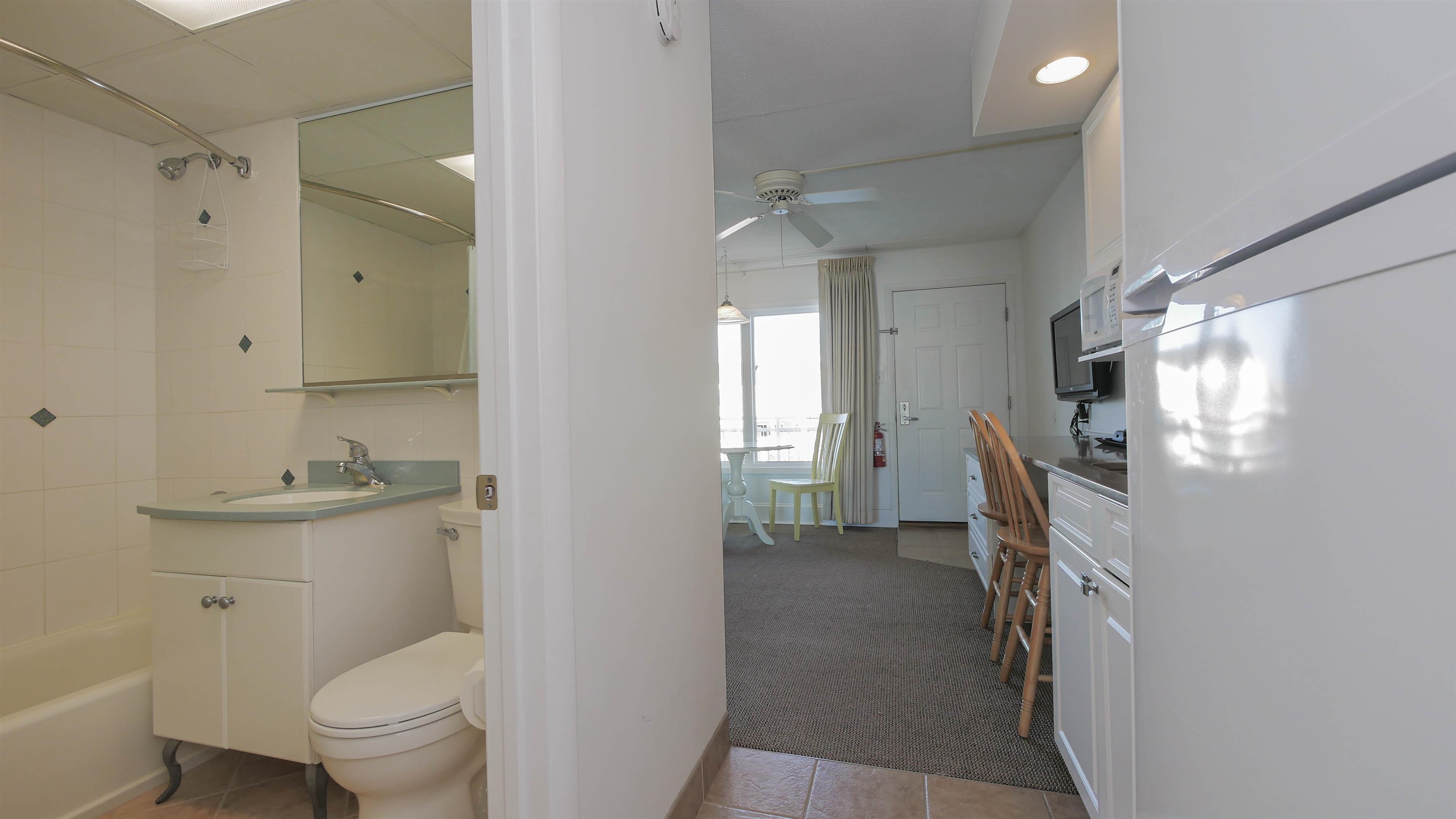 7800 Dune Drive, Unit 209 Avalon, NJ 08202 - Photo 14 of 21 a bathroom with a sink a toilet and shower