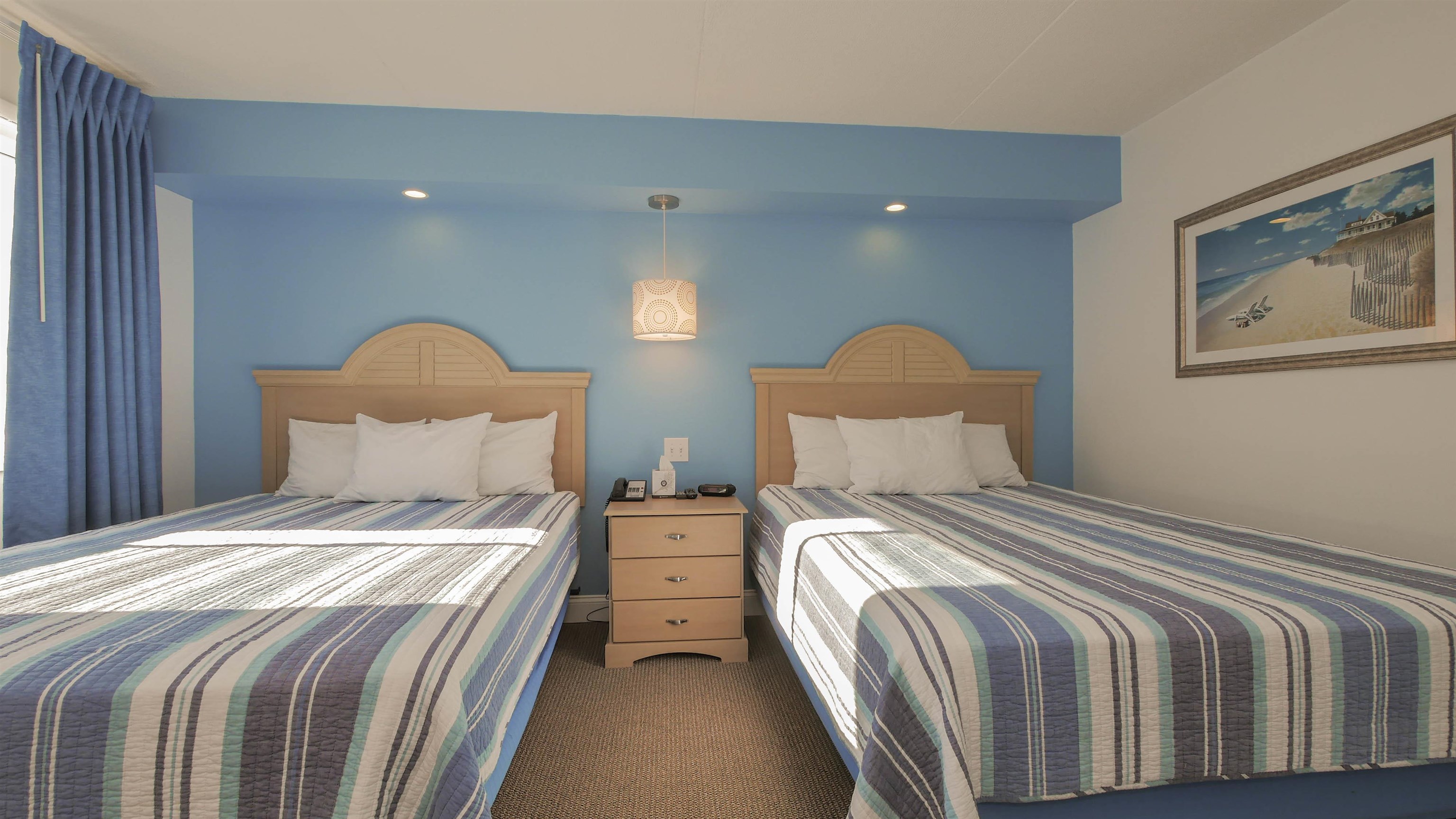 7800 Dune Drive, Unit 209 Avalon, NJ 08202 - Photo 18 of 21 a bedroom with a bed and painting on the wall