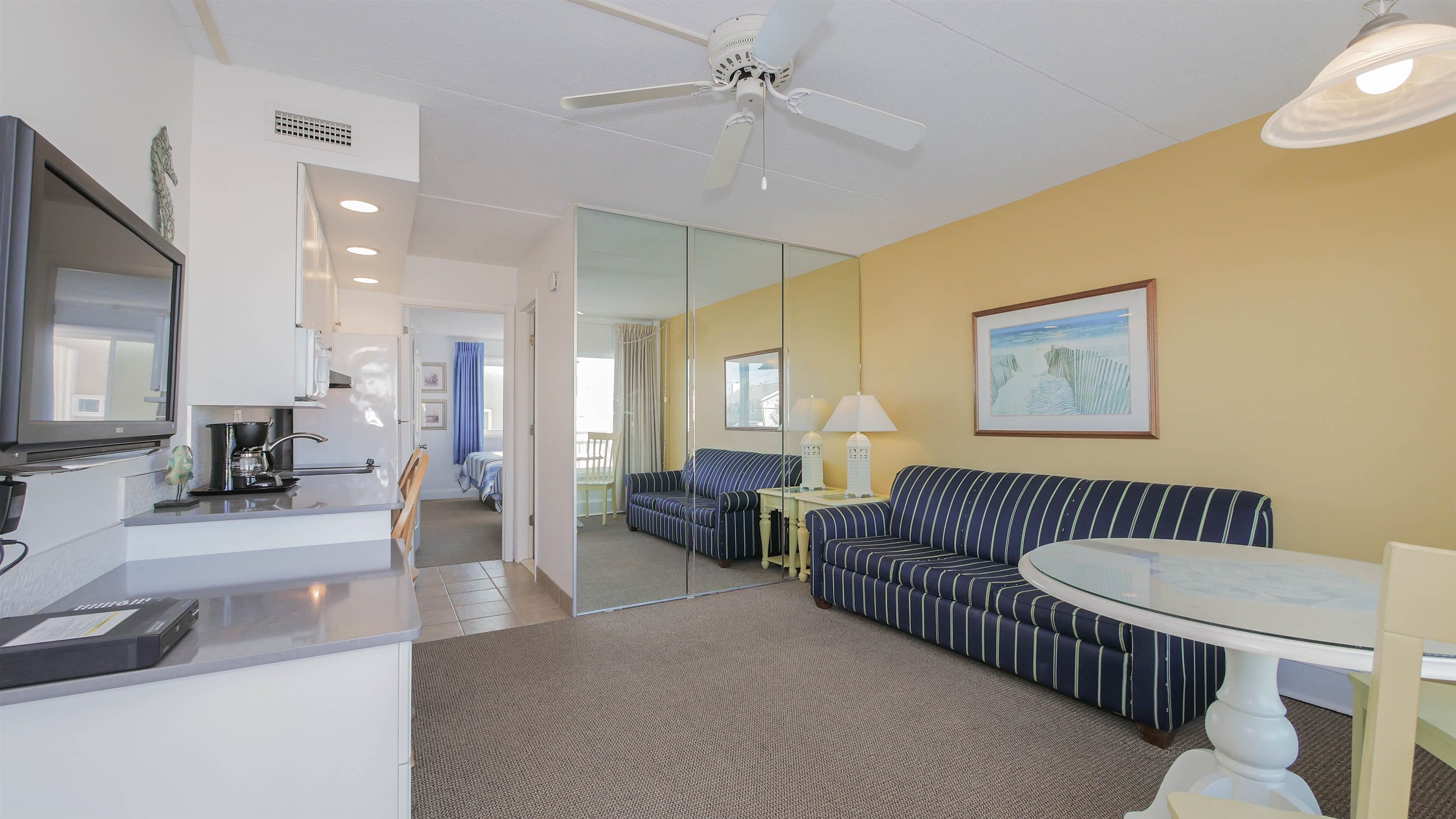 7800 Dune Drive, Unit 209 Avalon, NJ 08202 - Photo 7 of 21 a living room with furniture and a wooden floor