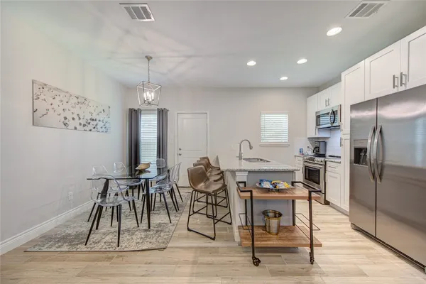 a view of a dining room with furniture