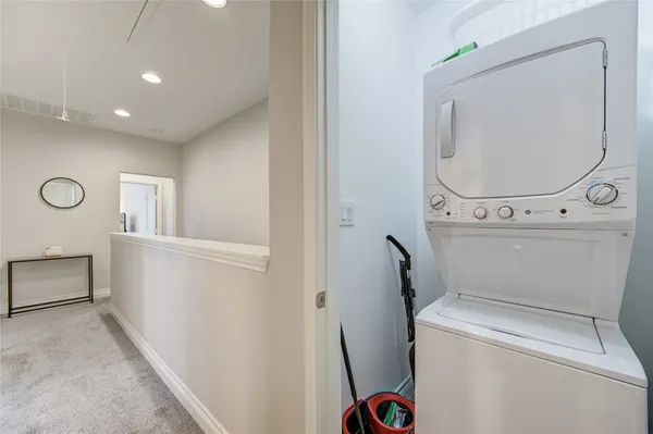 a view of storage and utility room with washer and dryer