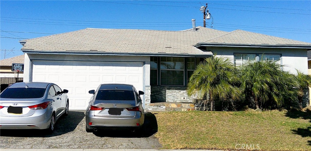 1505 West 136th Street Compton, CA 90222 - Photo 1 of 6 a car parked in front of a house