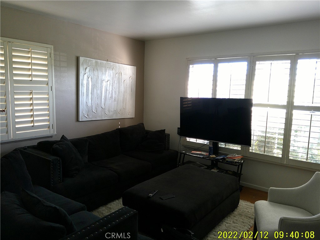 1505 West 136th Street Compton, CA 90222 - Photo 2 of 6 a living room with furniture and a flat screen tv