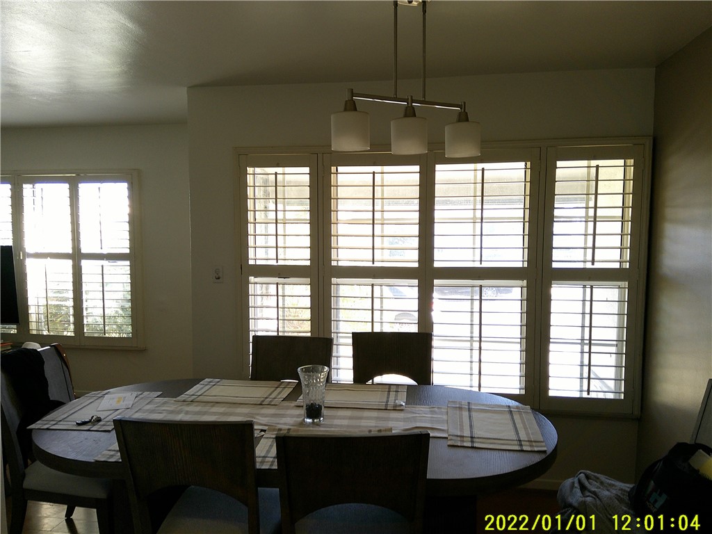 1505 West 136th Street Compton, CA 90222 - Photo 3 of 6 a view of a dining room with furniture window and outside view